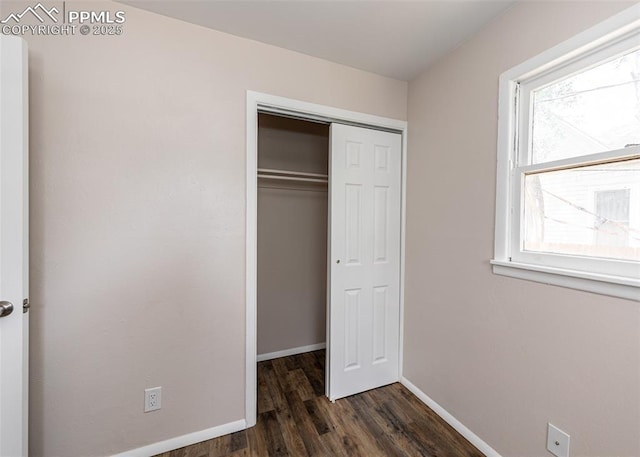 909 E Costilla St, Colorado Springs, CO 80903 - unfurnished bedroom featuring dark wood-style floors, baseboards, and a closet