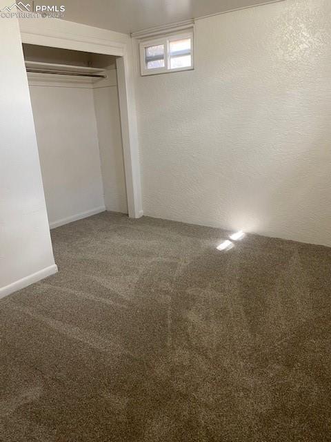 909 E Costilla St, Colorado Springs, CO 80903 - unfurnished bedroom featuring carpet and a closet