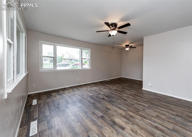 909 E Costilla St, Colorado Springs, CO 80903 - empty room featuring dark wood-style floors, a ceiling fan, and baseboards