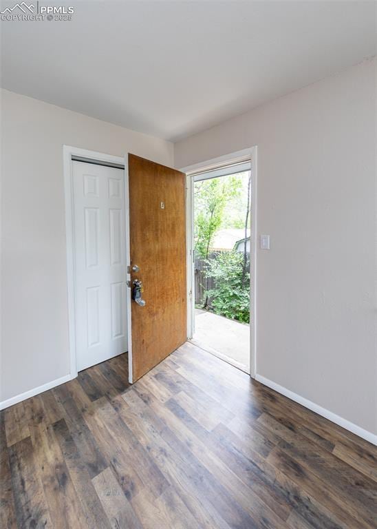 909 E Costilla St, Colorado Springs, CO 80903 - empty room featuring wood finished floors and baseboards