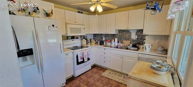 2510 N Union Blvd, Colorado Springs, CO 80909 - kitchen featuring white appliances, a sink, light countertops, a ceiling fan, and white cabinetry
