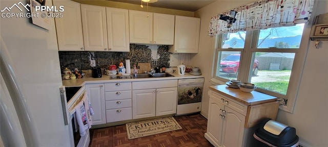 2510 N Union Blvd, Colorado Springs, CO 80909 - kitchen with white appliances, light countertops, a sink, and white cabinetry