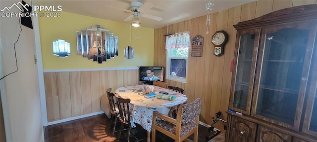 2510 N Union Blvd, Colorado Springs, CO 80909 - dining area with wooden walls, dark wood-type flooring, ceiling fan, and baseboards