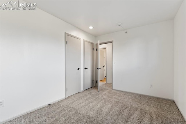 2115 Friendship Cir, Colorado Springs, CO 80904 - empty room featuring light colored carpet and recessed lighting