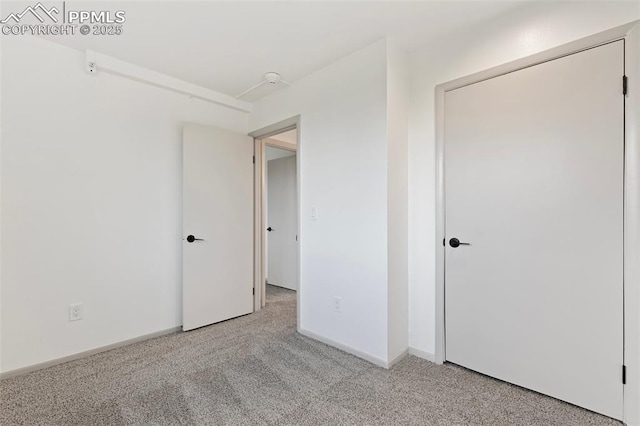 2115 Friendship Cir, Colorado Springs, CO 80904 - unfurnished bedroom with light carpet and baseboards