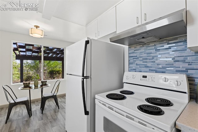 2115 Friendship Cir, Colorado Springs, CO 80904 - kitchen featuring electric stove, range hood, white cabinetry, tasteful backsplash, and light countertops