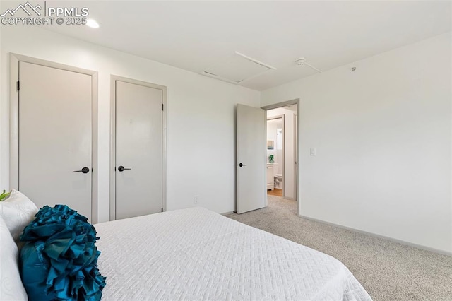2115 Friendship Cir, Colorado Springs, CO 80904 - carpeted bedroom featuring attic access, multiple closets, and baseboards
