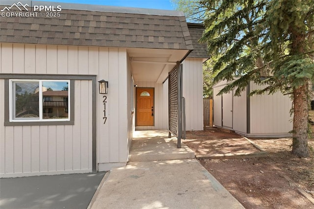 2115 Friendship Cir, Colorado Springs, CO 80904 - property entrance with roof with shingles and mansard roof