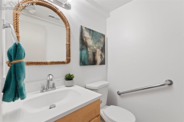 2115 Friendship Cir, Colorado Springs, CO 80904 - half bath featuring toilet and vanity