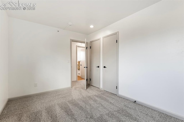 2115 Friendship Cir, Colorado Springs, CO 80904 - unfurnished room featuring light colored carpet, baseboards, and recessed lighting