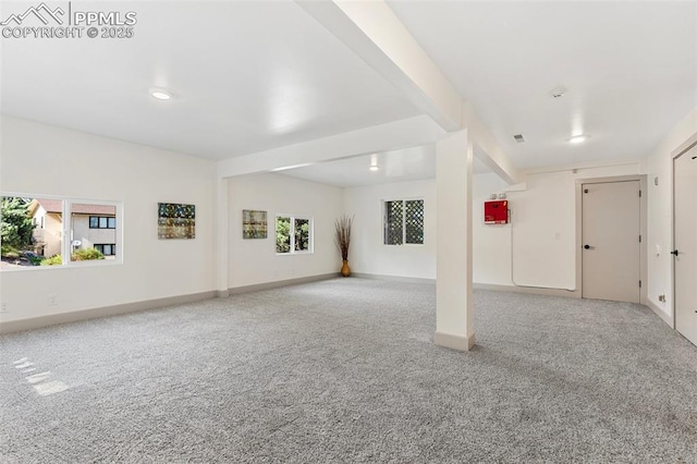 2115 Friendship Cir, Colorado Springs, CO 80904 - unfurnished living room with carpet floors, healthy amount of natural light, and baseboards