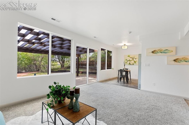 2115 Friendship Cir, Colorado Springs, CO 80904 - living area with carpet flooring and baseboards