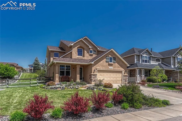 2044 Coldstone Way, Colorado Springs, CO 80921 - view of front of house with driveway, stucco siding, stone siding, and an attached garage