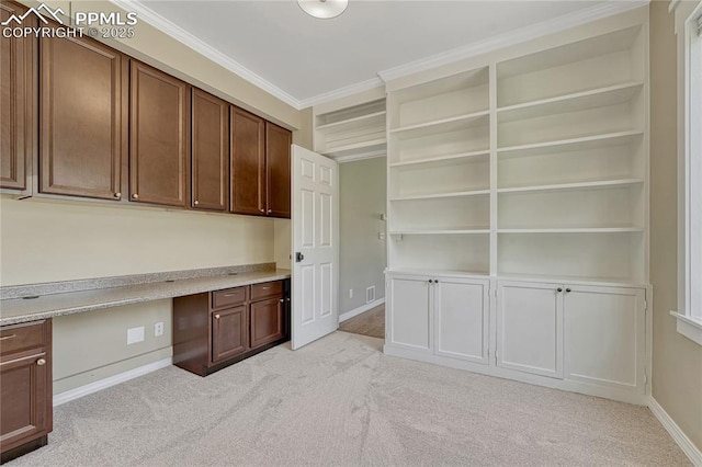 2044 Coldstone Way, Colorado Springs, CO 80921 - unfurnished office featuring light carpet, built in study area, baseboards, and ornamental molding