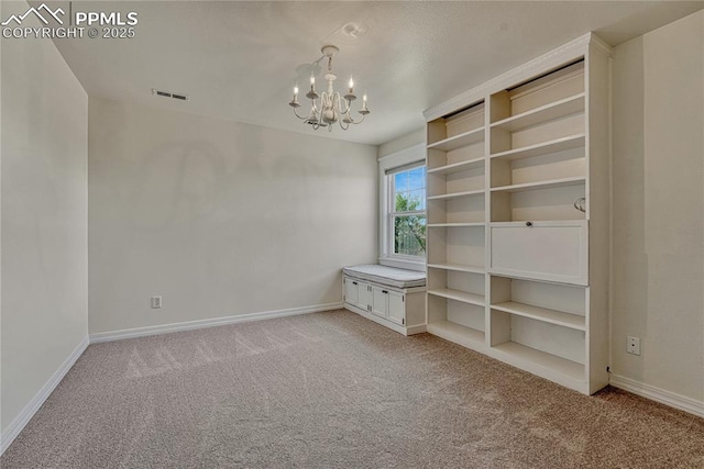 2044 Coldstone Way, Colorado Springs, CO 80921 - empty room with a chandelier, light colored carpet, and baseboards