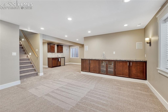 2044 Coldstone Way, Colorado Springs, CO 80921 - unfurnished living room with light carpet, baseboards, and recessed lighting