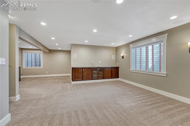 2044 Coldstone Way, Colorado Springs, CO 80921 - basement with baseboards, light carpet, healthy amount of natural light, and recessed lighting