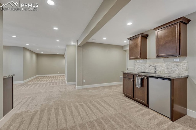 2044 Coldstone Way, Colorado Springs, CO 80921 - kitchen featuring fridge, light carpet, recessed lighting, a sink, and baseboards