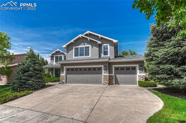 9524 Pinebrook Way, Colorado Springs, CO 80920 - view of front of house featuring stone siding, a garage, and driveway