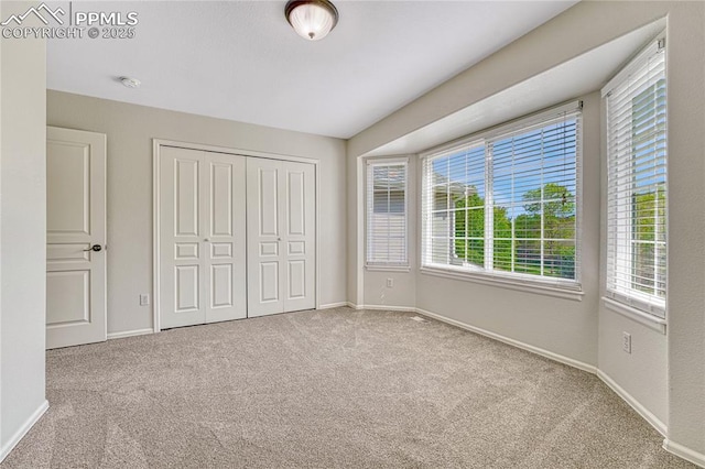 9524 Pinebrook Way, Colorado Springs, CO 80920 - unfurnished bedroom featuring carpet floors and multiple windows
