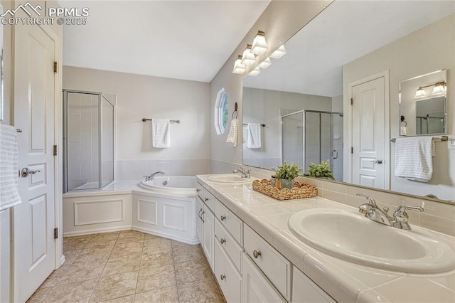 9524 Pinebrook Way, Colorado Springs, CO 80920 - bathroom featuring a garden tub, double vanity, and a shower stall