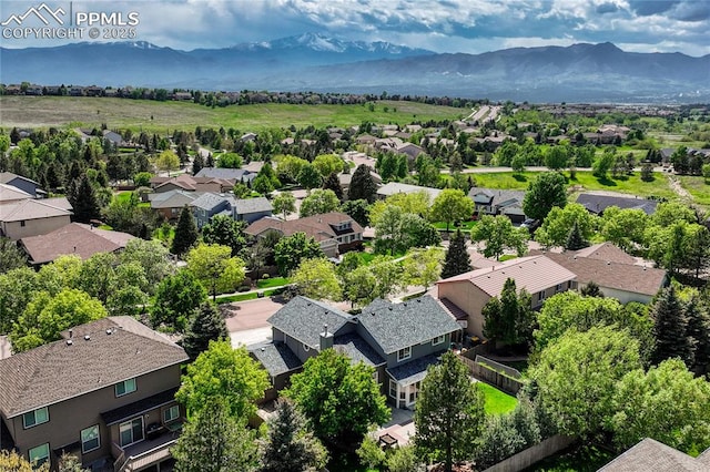 9524 Pinebrook Way, Colorado Springs, CO 80920 - aerial view of residential area featuring a mountain backdrop
