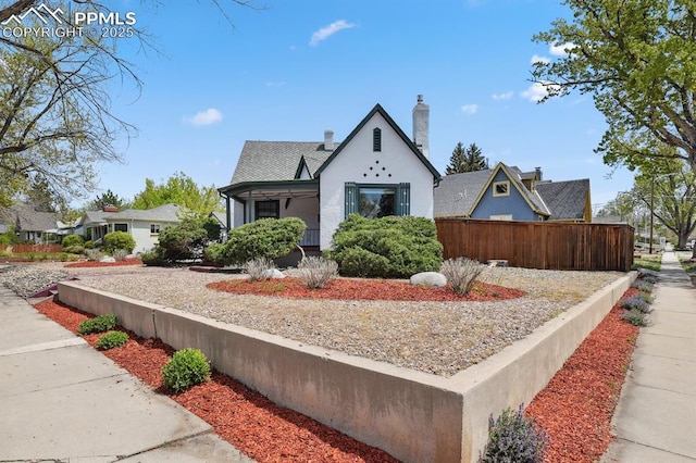 1003 N Institute St, Colorado Springs, CO 80903 - view of front facade featuring a chimney and stucco siding