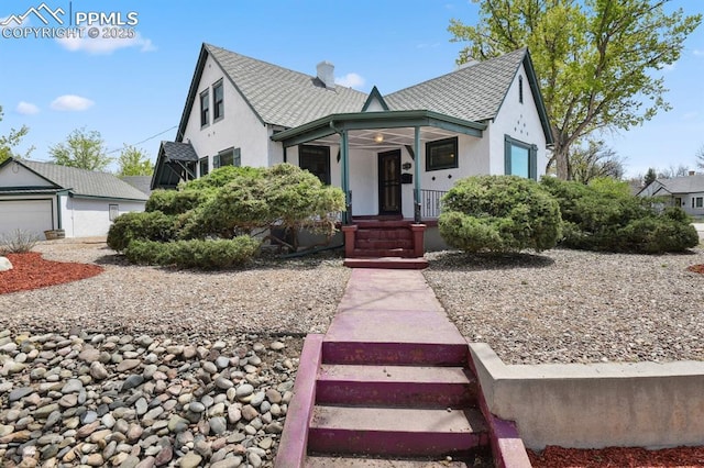1003 N Institute St, Colorado Springs, CO 80903 - tudor home featuring stucco siding and roof with shingles