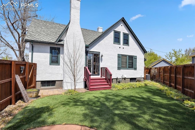 1003 N Institute St, Colorado Springs, CO 80903 - back of house featuring roof with shingles, a chimney, central AC unit, and stucco siding