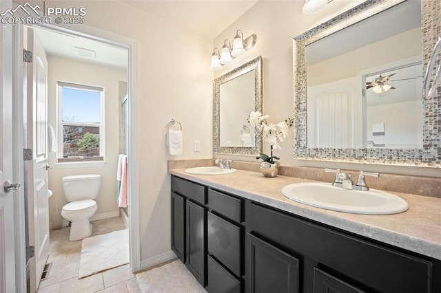 full bath with toilet, double vanity, tile patterned floors, an enclosed shower, and baseboards