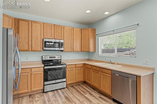 2265 Sage Grouse Ln, Colorado Springs, CO 80951 - kitchen featuring stainless steel appliances, a sink, recessed lighting, light countertops, and light wood-type flooring