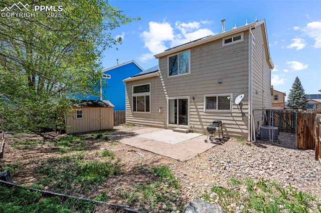 2265 Sage Grouse Ln, Colorado Springs, CO 80951 - back of property with a patio area, a storage unit, a fenced backyard, and an outdoor structure
