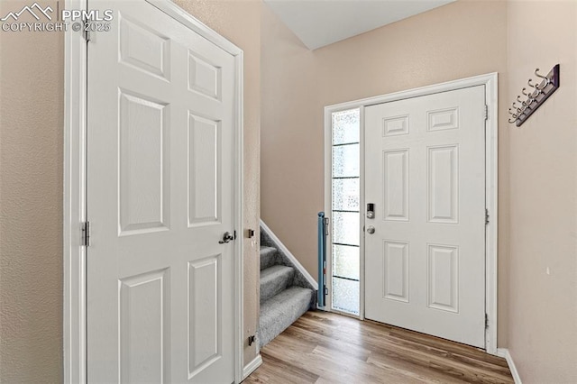2265 Sage Grouse Ln, Colorado Springs, CO 80951 - foyer featuring wood finished floors and stairway