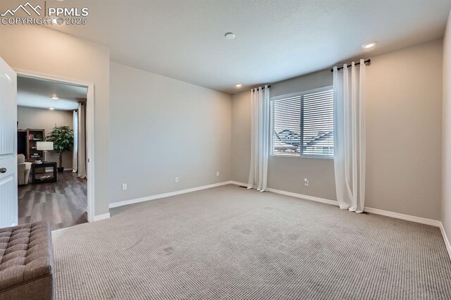 10737 Rolling Mesa Dr, Falcon, CO 80831 - empty room with baseboards, carpet floors, and recessed lighting