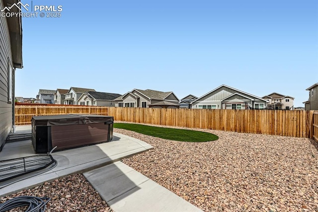 10737 Rolling Mesa Dr, Falcon, CO 80831 - fenced backyard with a hot tub, a residential view, and a patio