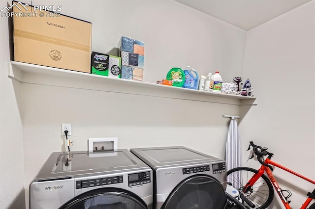 10737 Rolling Mesa Dr, Falcon, CO 80831 - laundry room featuring washer and clothes dryer
