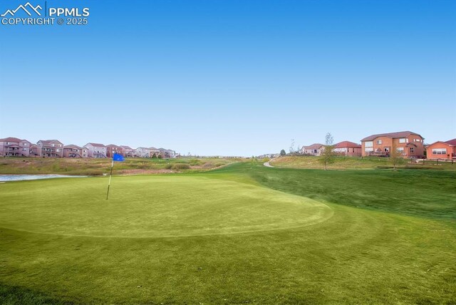 10737 Rolling Mesa Dr, Falcon, CO 80831 - view of community with a residential view, view of golf course, an area to practice putting, and a water view