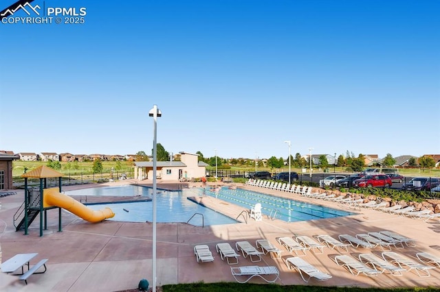 10737 Rolling Mesa Dr, Falcon, CO 80831 - community pool with fence and a patio