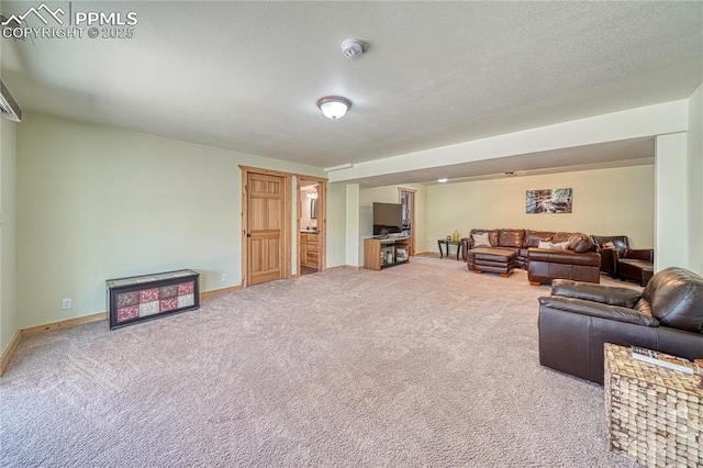 living area featuring carpet flooring and baseboards