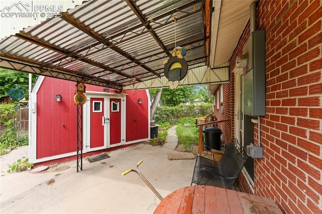 138 Hayes Dr, Colorado Springs, CO 80911 - view of patio with an outbuilding