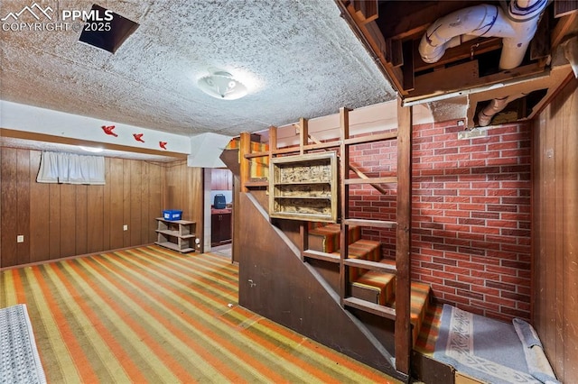 138 Hayes Dr, Colorado Springs, CO 80911 - finished below grade area with wood walls and brick wall