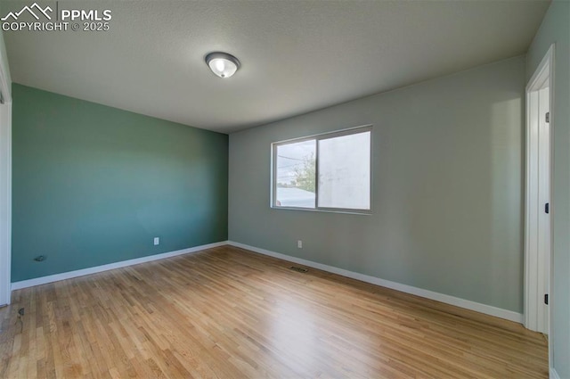 98 Security Cir, Colorado Springs, CO 80911 - spare room featuring wood finished floors and baseboards