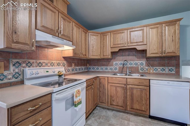 98 Security Cir, Colorado Springs, CO 80911 - kitchen with white appliances, a sink, under cabinet range hood, tasteful backsplash, and light countertops