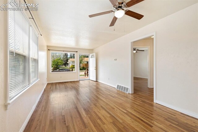 207 N 20th St, Colorado Springs, CO 80904 - spare room with wood finished floors, ceiling fan, and baseboards
