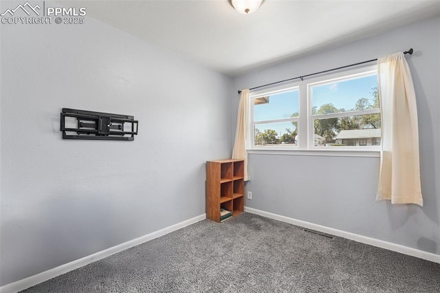 2744 Ron Ct, Colorado Springs, CO 80909 - unfurnished room with carpet floors and baseboards