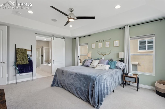 6949 Compass Bend Dr, Colorado Springs, CO 80927 - bedroom with carpet flooring, a barn door, multiple windows, recessed lighting, and baseboards