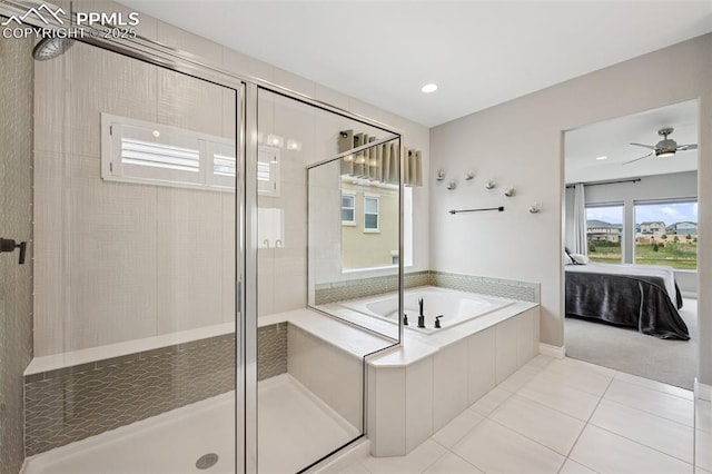 6949 Compass Bend Dr, Colorado Springs, CO 80927 - full bathroom featuring ensuite bath, a stall shower, a bath, tile patterned floors, and ceiling fan