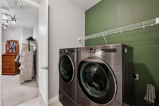 6949 Compass Bend Dr, Colorado Springs, CO 80927 - washroom featuring washing machine and dryer, carpet floors, a textured wall, and baseboards