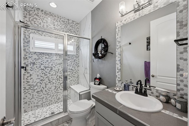 6949 Compass Bend Dr, Colorado Springs, CO 80927 - bathroom featuring vanity, toilet, and a shower stall