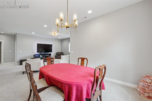 6949 Compass Bend Dr, Colorado Springs, CO 80927 - dining area with light colored carpet, recessed lighting, a chandelier, and baseboards